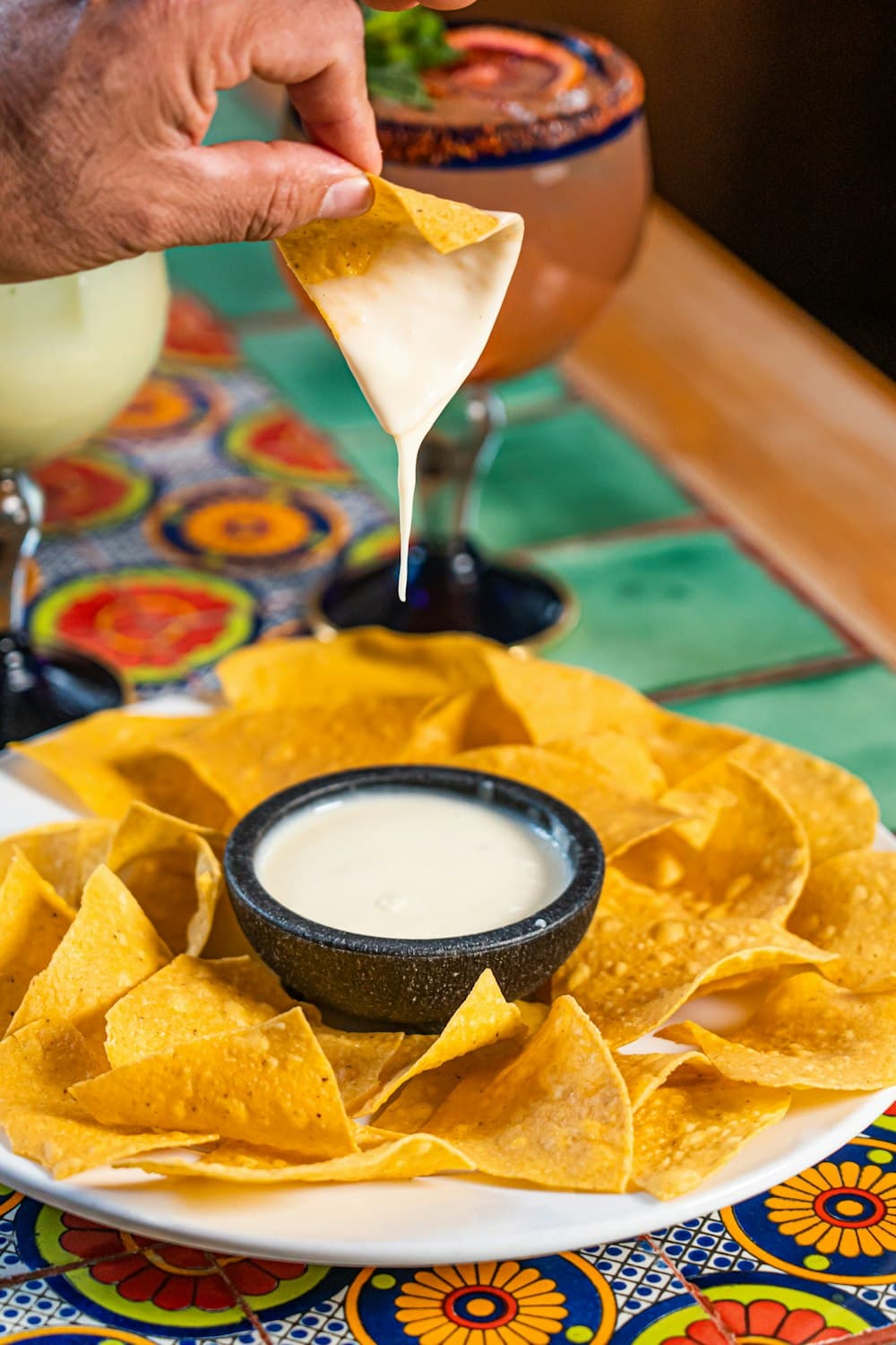 Tortilla chips with melted cheese dip — demo imagery