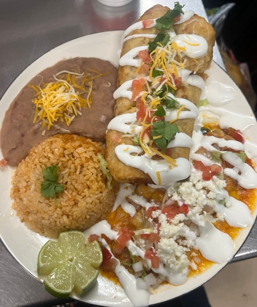 Combo dinner with burrito, rice, beans, and sauce from Melendez Imports